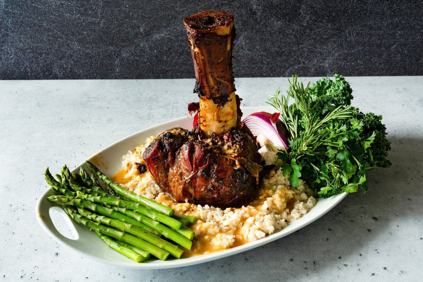 Thor's hammer plated with mushroom risotto and asparagus. 